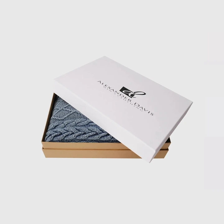 Folded boutique clothing in elegant box