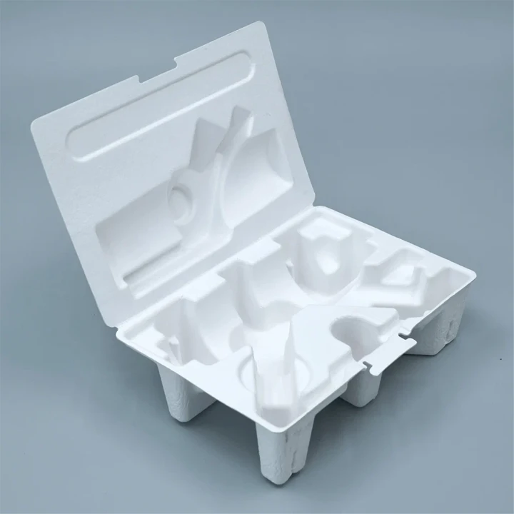 Molded pulp tray with shaped compartments