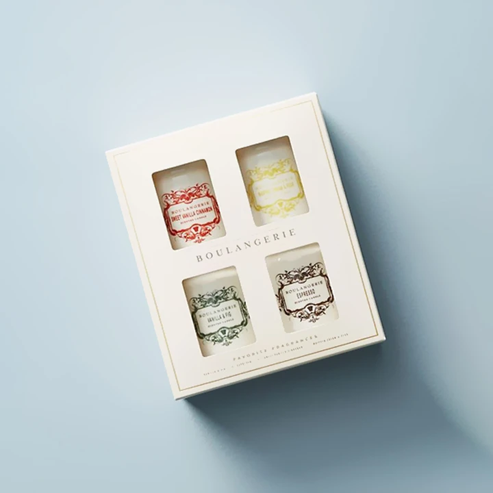 Window box displaying a packaged candle